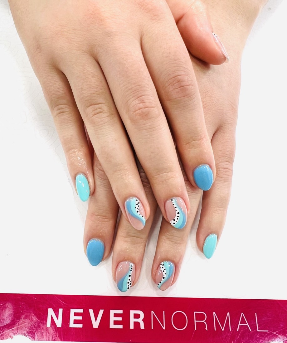 Short almond nails with blue and white abstract swirl nail art